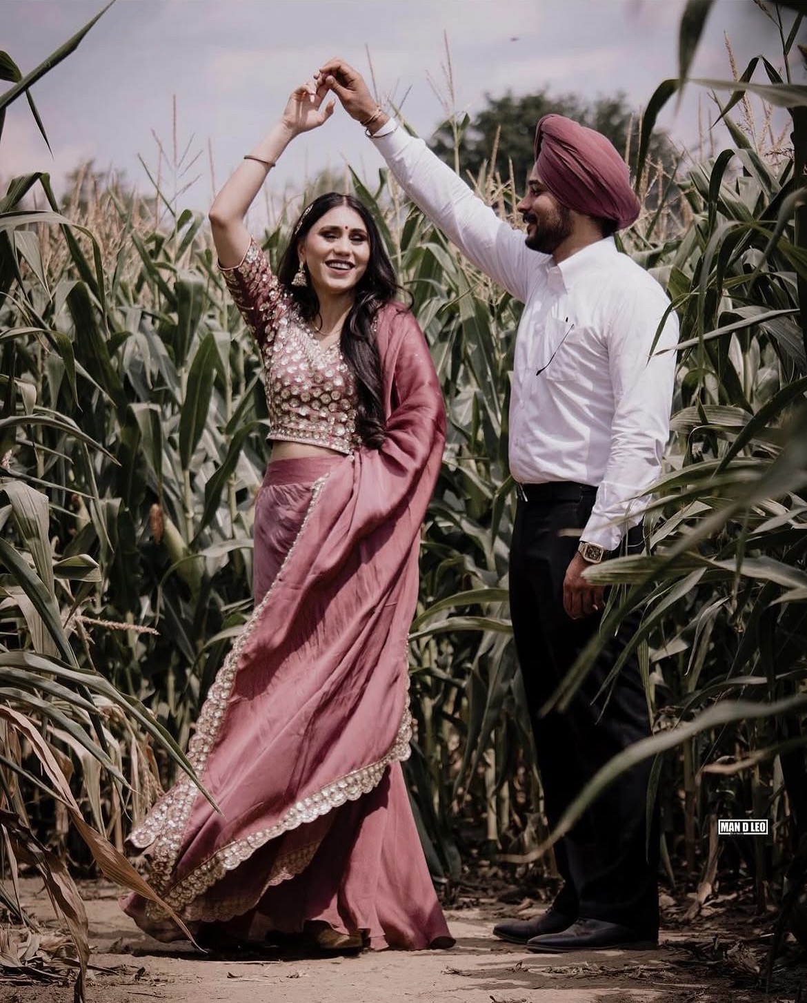 A couple dancing together in a field